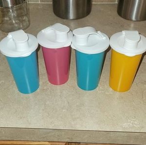 Set of 4 Tupperware cups with lids never used